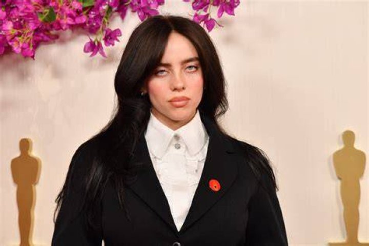 Billie Eilish, 21, and her boyfriend Jesse Rutherford, 31, hold hands