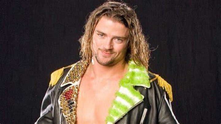 Brian Kendrick posing on the top turnbuckle