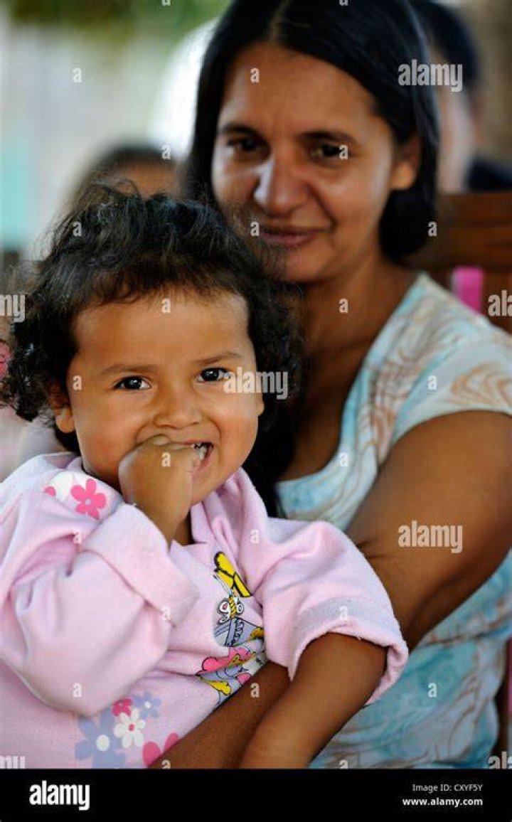 images/kumedicine/2017/Colleen-2012-paraguay.jpg Child and mother from Paraguay being seen by a doctor