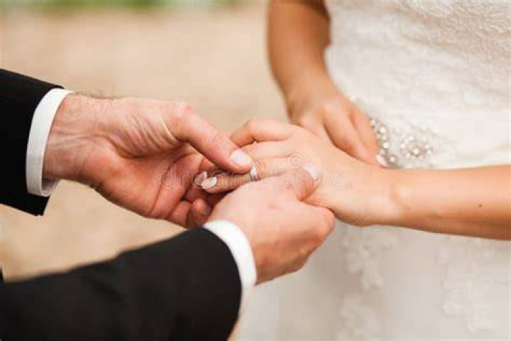 Groom Put On Wedding Ring Stock Photo Image 65022095