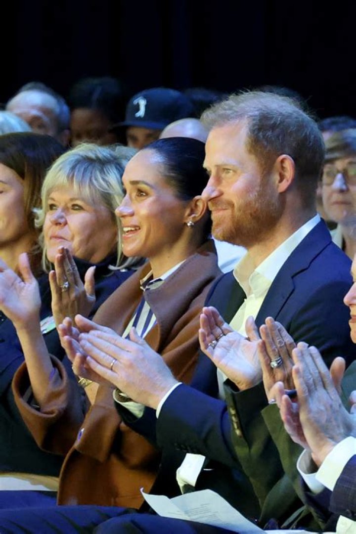 Harry and Meghan clapping 