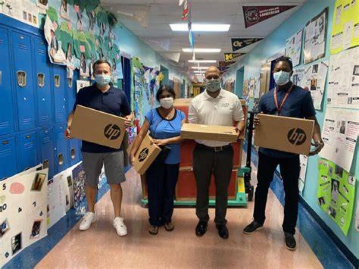 Infinity Sales Group Donates Laptops to West Palm Beach School ISG