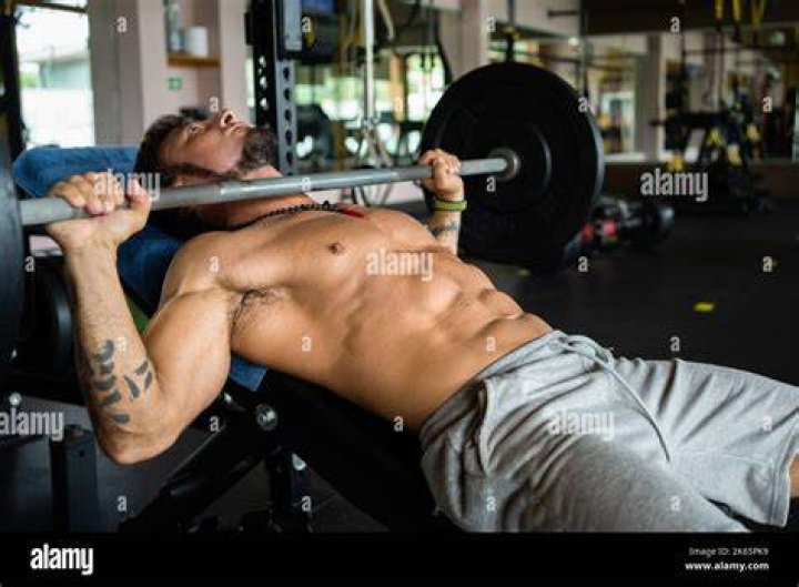 man doing bench press