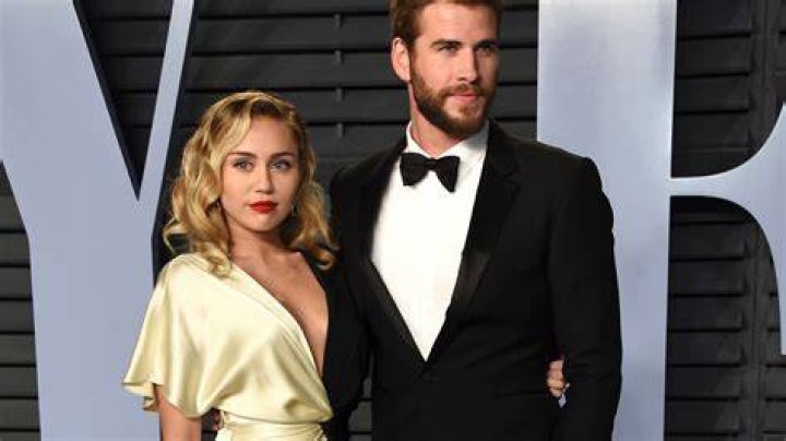 Miley Cyrus (left) and Liam Hemsworth (right) pre-split, attend the 2012 Vanity Fair Oscar Party. Photo / Getty Images