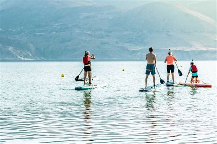 people paddle boarding in greece