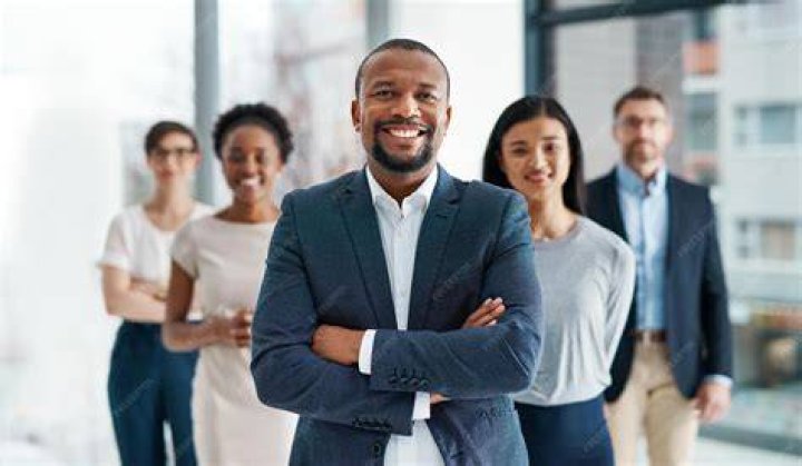 person smiling during a company meeting