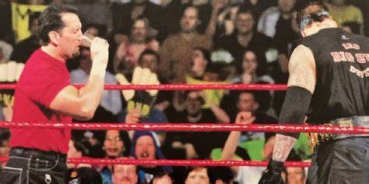 Tommy Dreamer drinking The Undertaker's tobacco spit