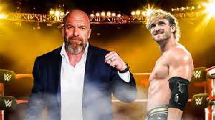triple h pointing to logan paul with the us title