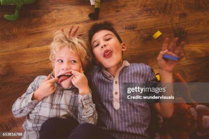 Two men making silly faces