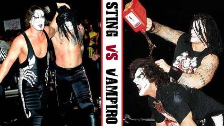Vampiro pulling Sting through the ring
