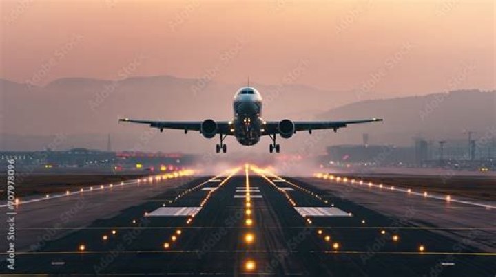 view of airplane lifting off runway