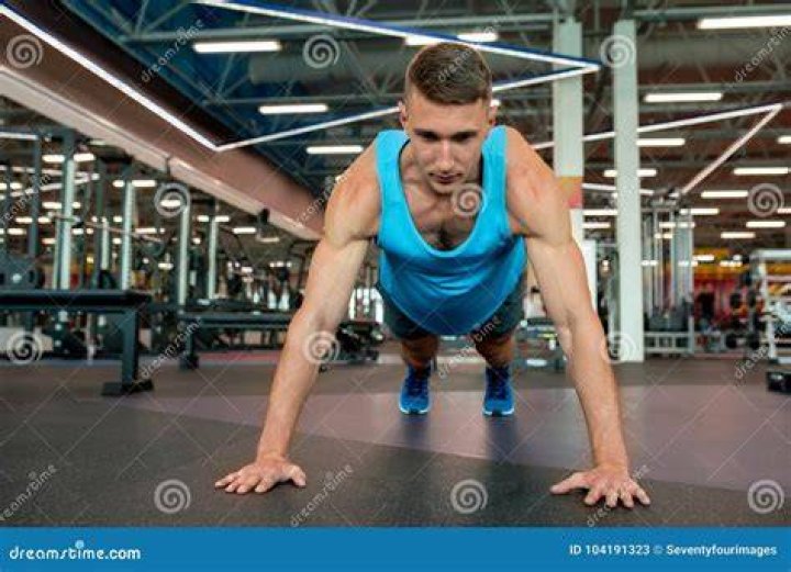 young man exercising at gym